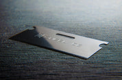 OneBlade Safety Razor Blade laying on table