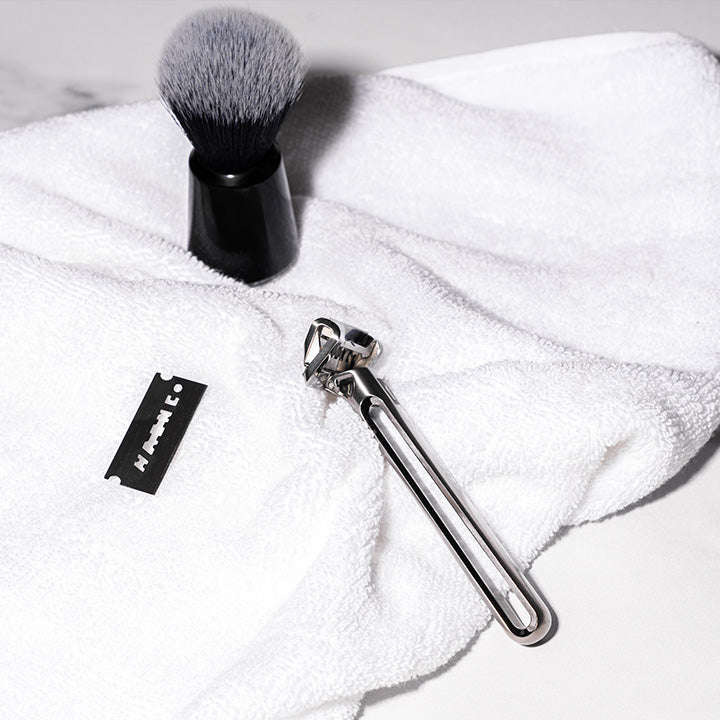 OneBlade Genesis, Blade, and Shaving Cream Brush on Towel