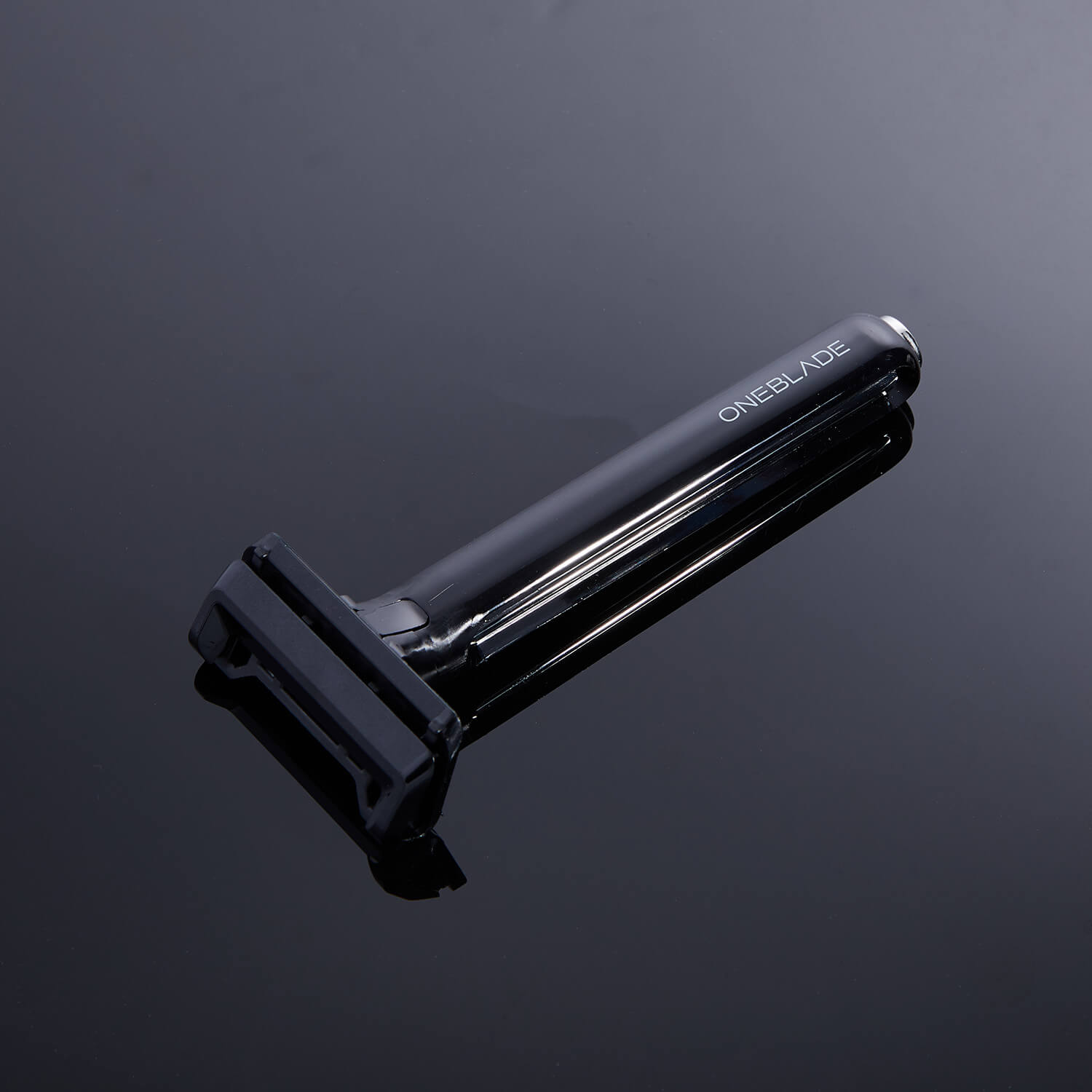 a black core single blade safety razor on black mirror