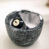 marble shaving kit bowl with brush resting in it