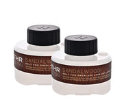 two sandalwood pods stacked neatly beside each other
